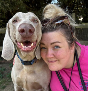 Leanne with dachshunds at the field gate