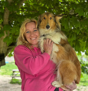 Rachel with dogs in the field